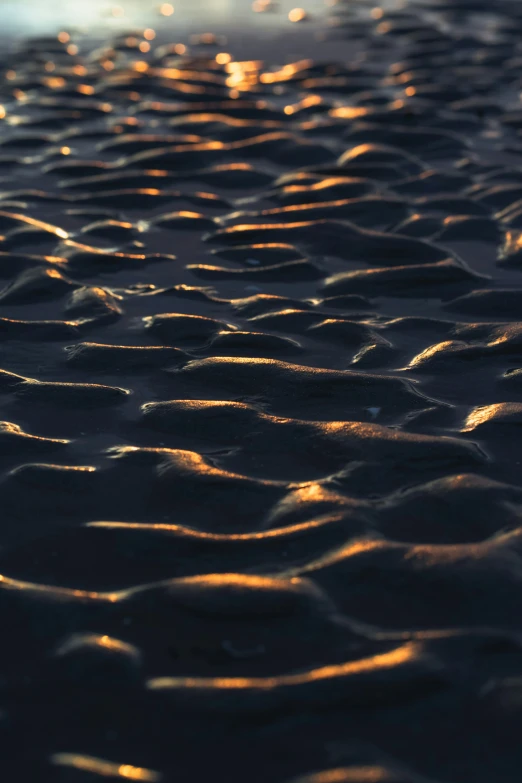 a picture of some sand and sky in the background