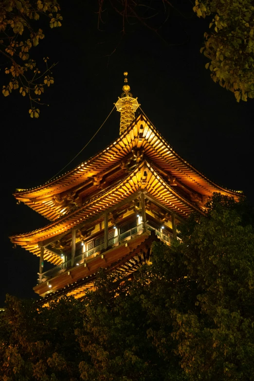 a tall building in the middle of a forest