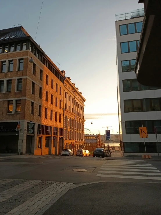 a street view of tall buildings and one is orange