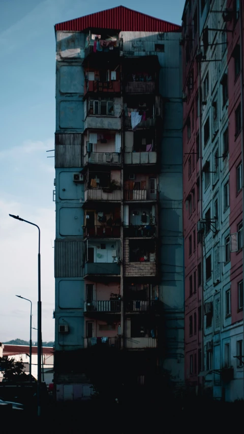 a tall building surrounded by tall buildings