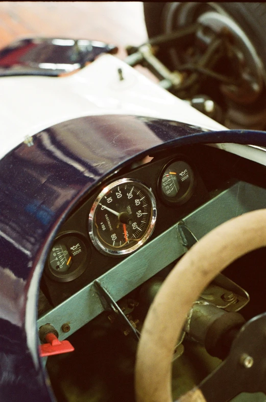 a steering wheel, dash light and dashboard in a race car