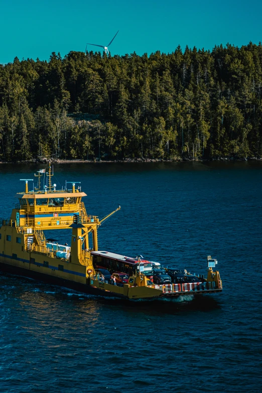 yellow and blue tug boat going on calm water