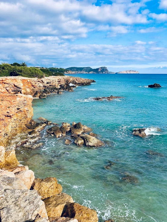 clear water and rocky shore at the beach