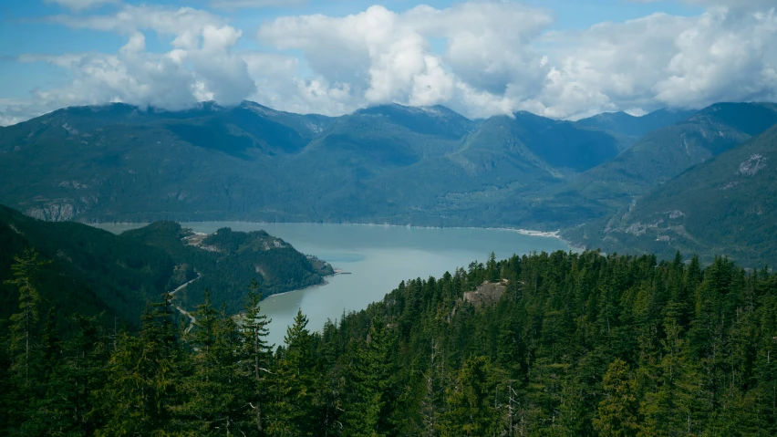 a mountain with a lake in the middle and large mountains