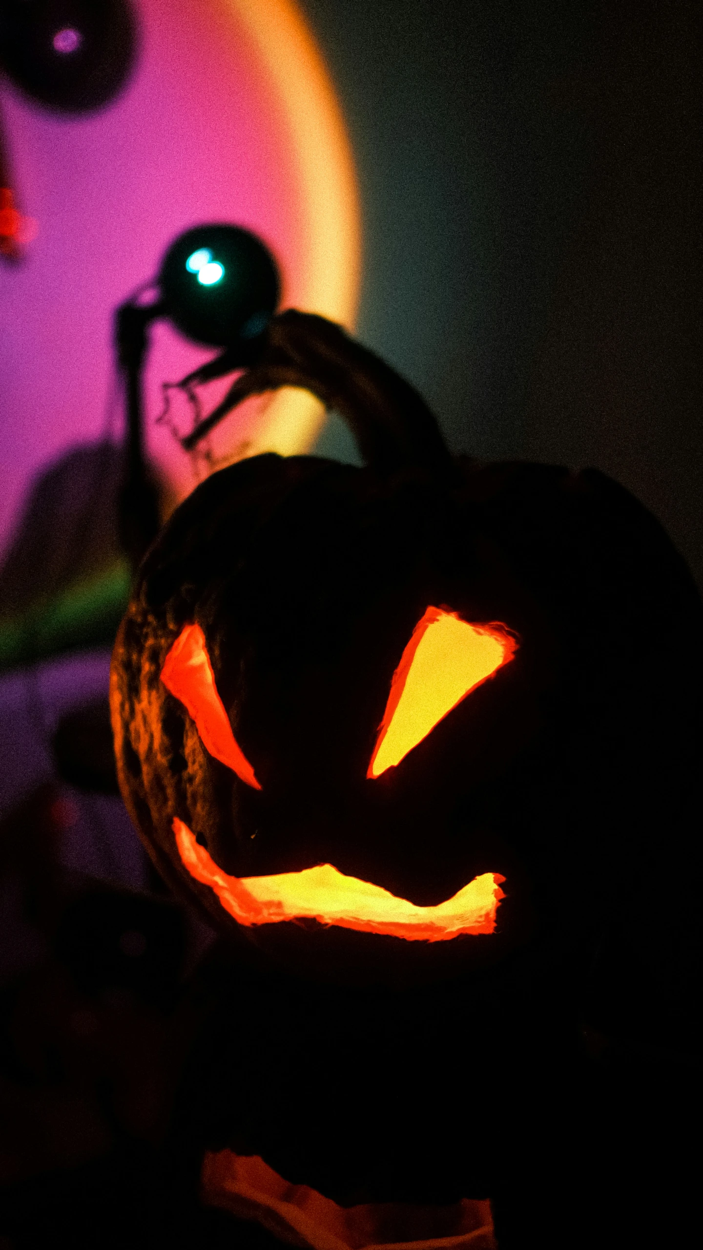 a lit pumpkin with a smile on it