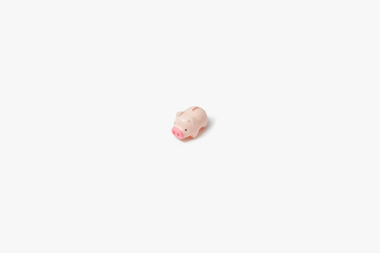 a small toy pig sits on its side