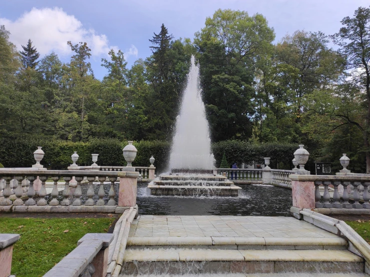 a view from the bottom of some steps of a fountain