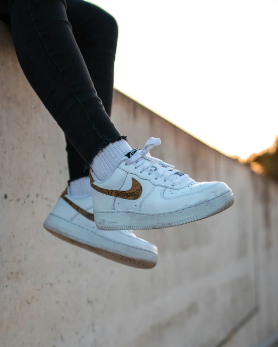 a person jumping up a ledge in the air