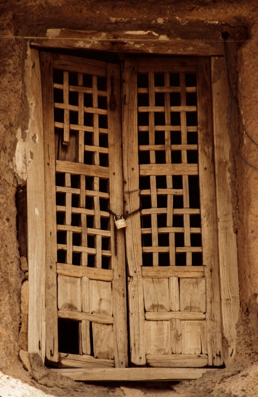 an old doorway is decorated in wood and windows