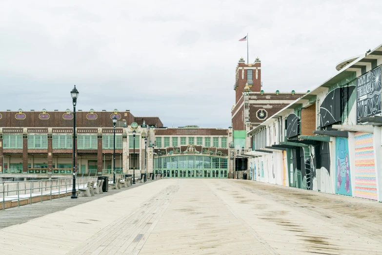 a couple of buildings are sitting on a dirt road