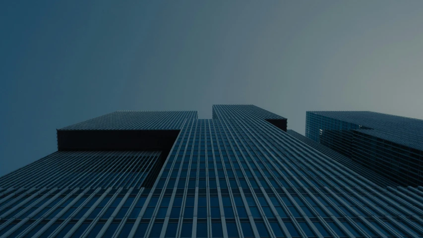 high rise building with several windows and sky background