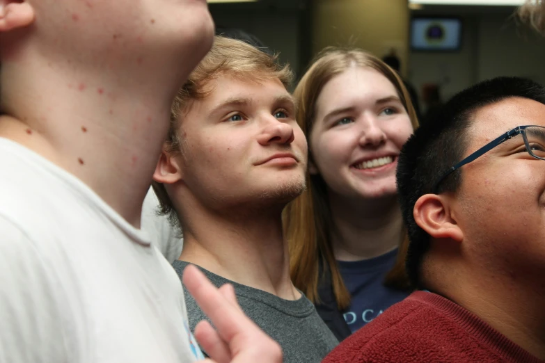 there are several young men standing close together