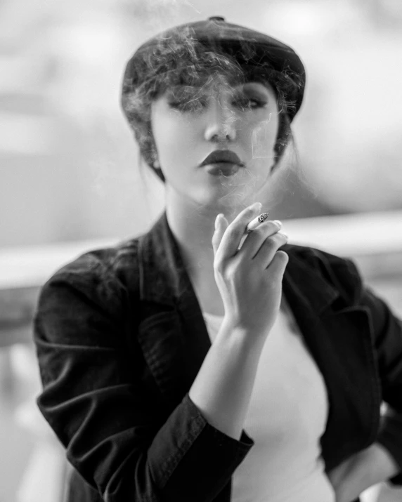 woman smoking and looking away with a cigarette