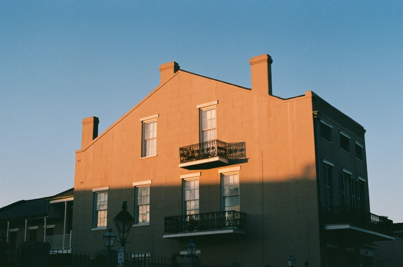 a building with several windows and balconies on the side