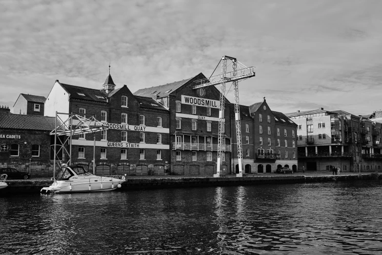 a boat on the water in front of a building