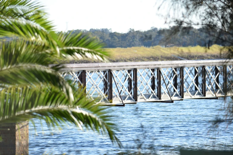 the water and the bridge is blue and clear