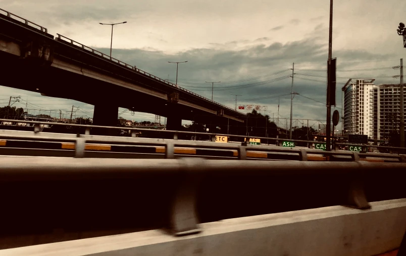 an freeway bridge over looking a traffic light