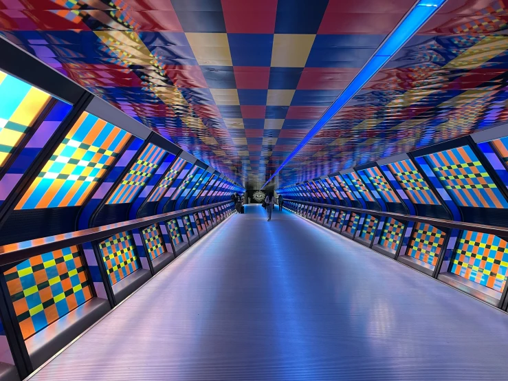a tunnel with colorful wallpaper in the background