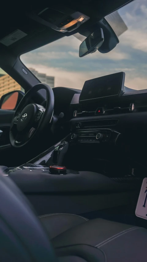 a car dashboard is showing a gps device and a digital tablet