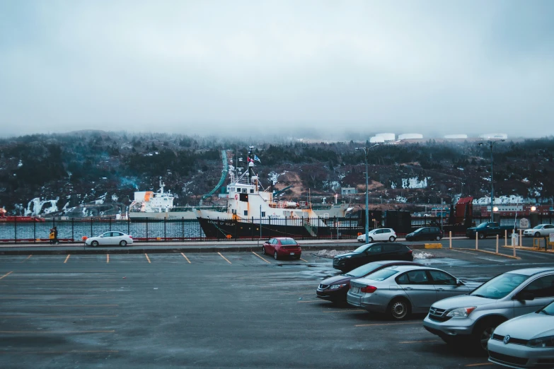 an empty parking lot with two boats docked