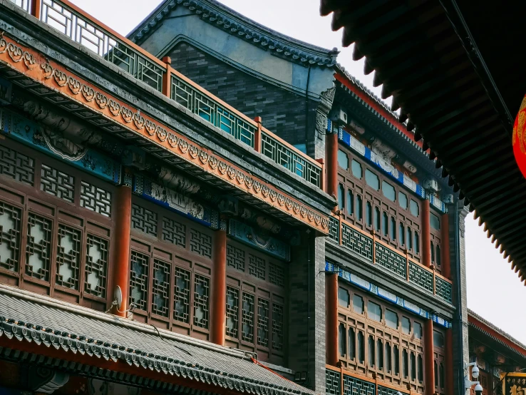 a building with a balcony and ornate decorations on it