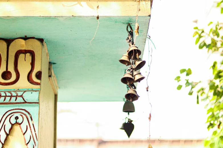 a colorful outdoor decoration is hanging from the roof