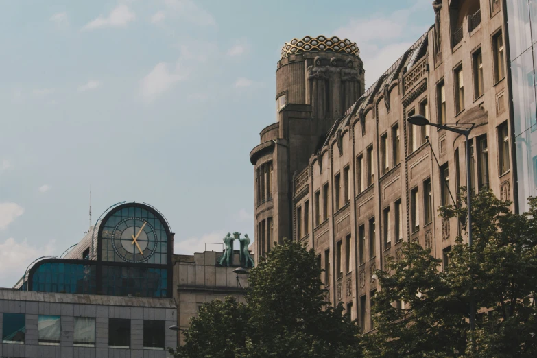 a clock on the front of a tall building