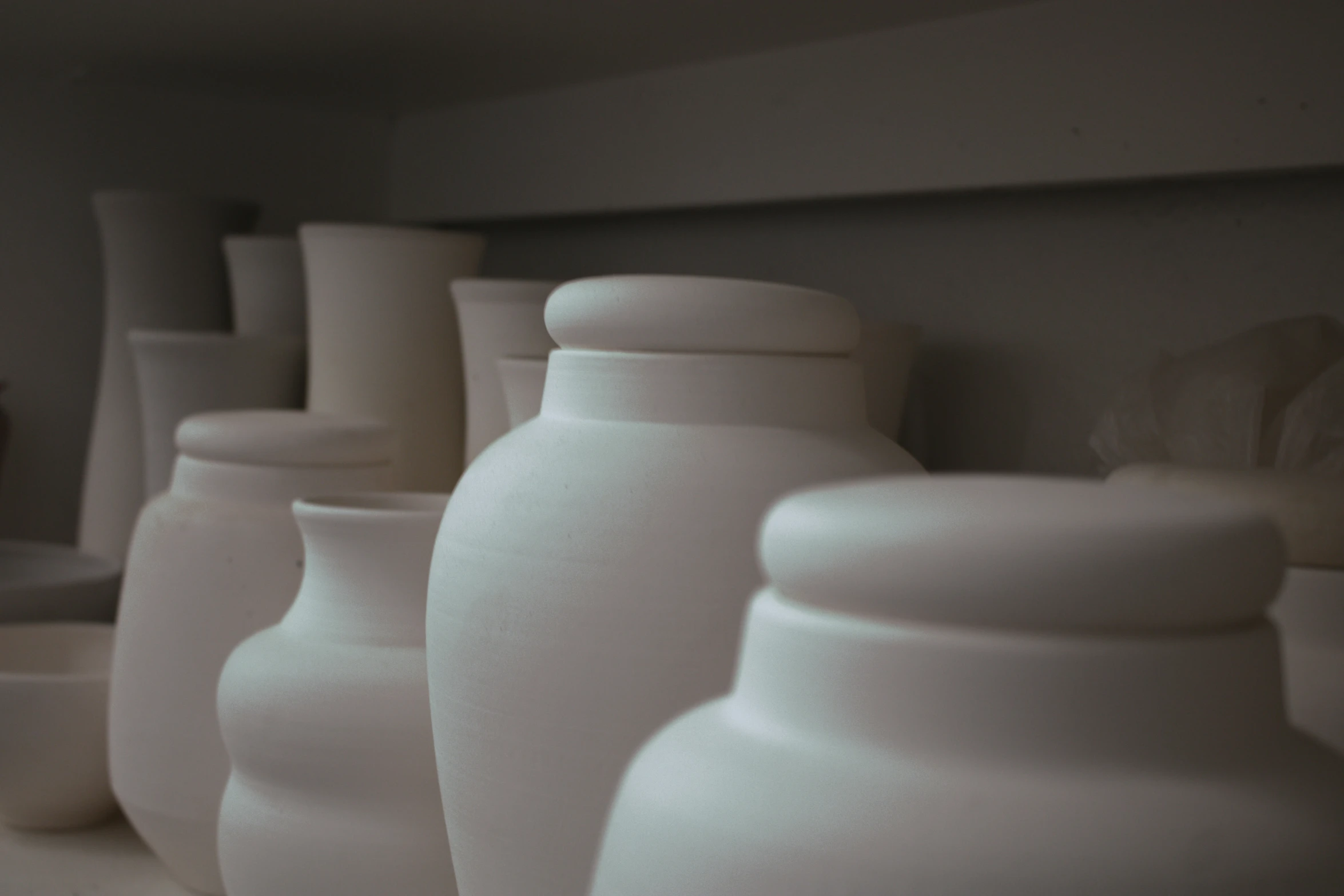 close up of many white vases on display