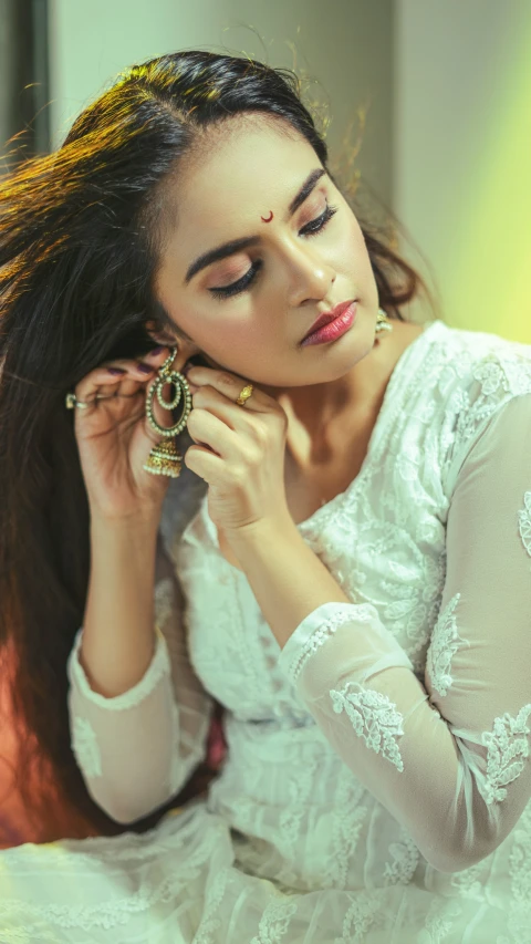 beautiful woman holding her hair in the wind