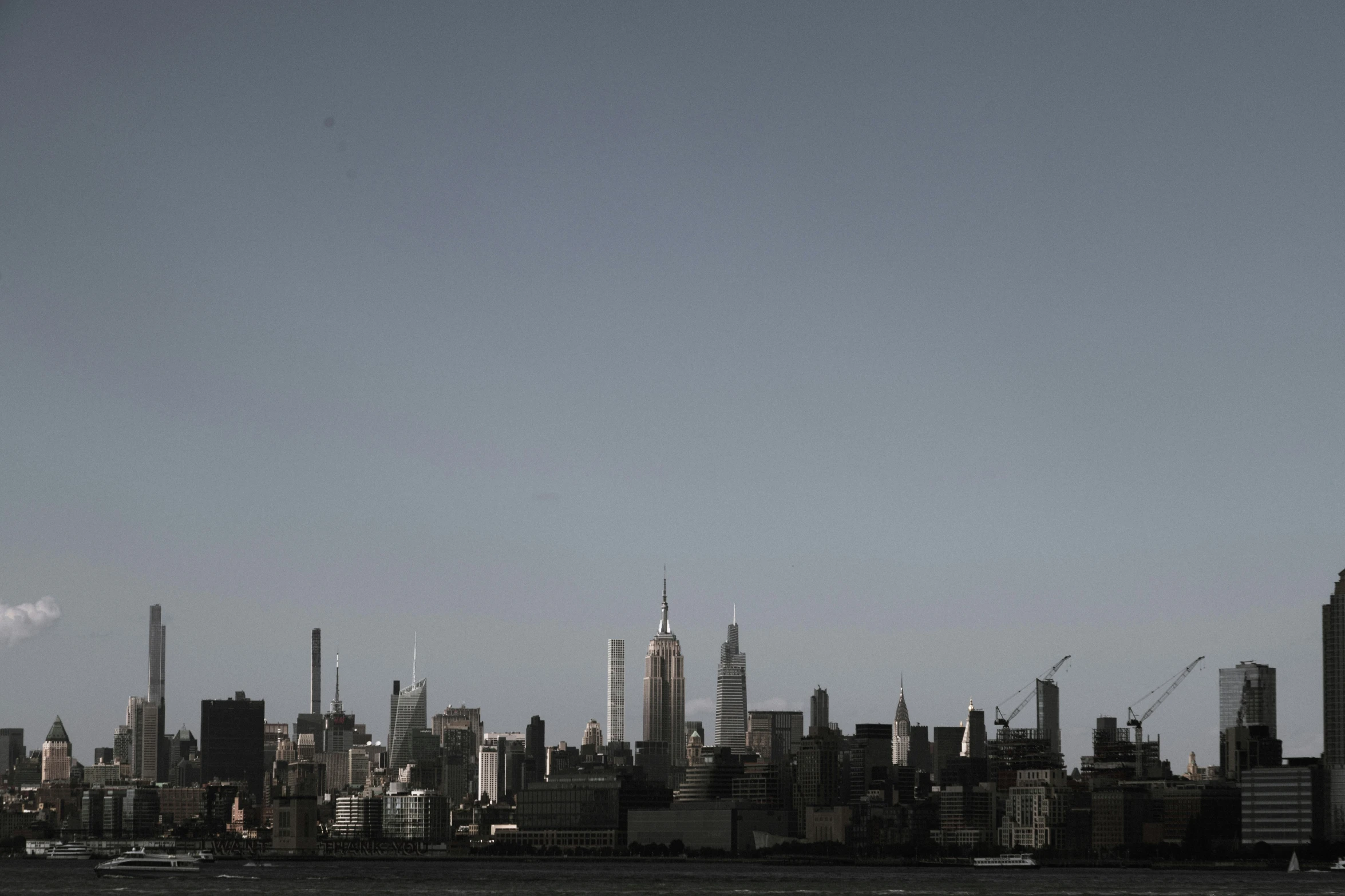 the skyline of a city seen from across the water