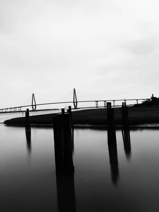 the bridge stretches over the calm water