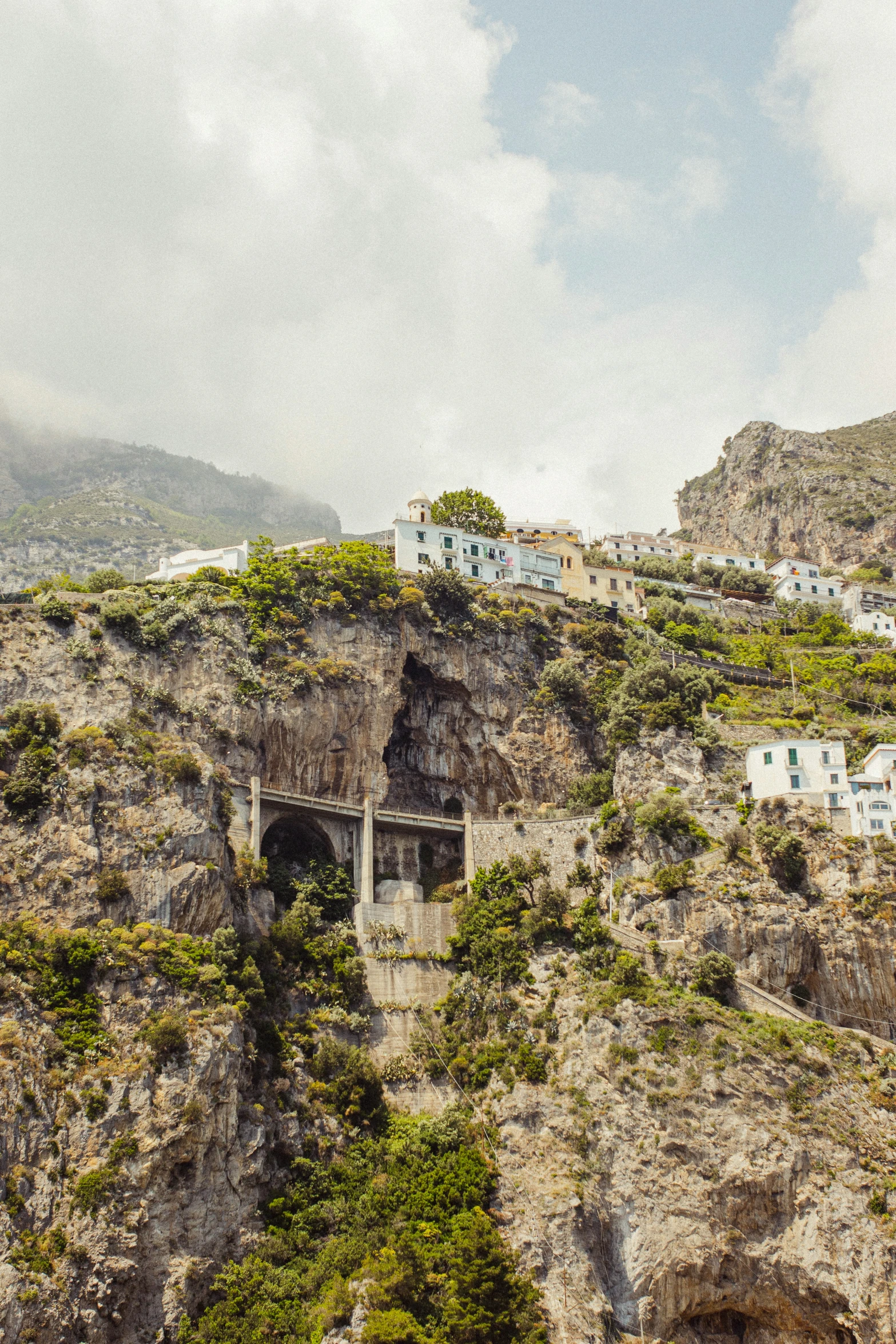 several buildings on the top of a hill