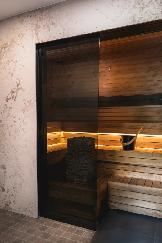 the steam room has a bench and several wooden benches