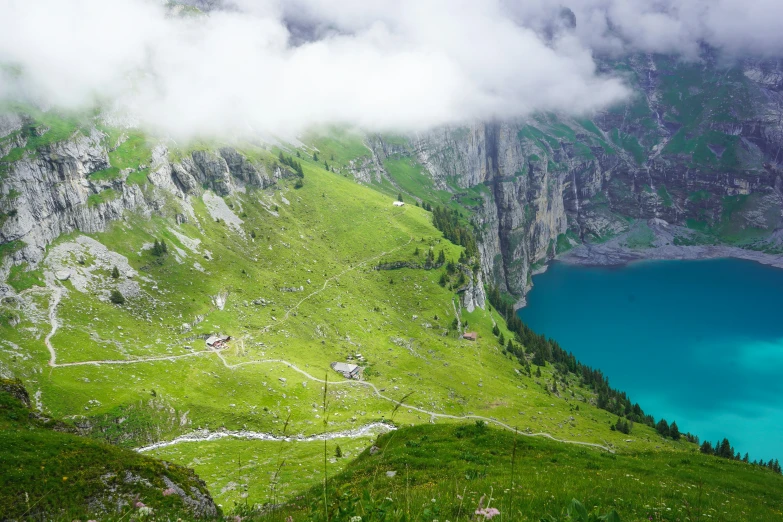 the valley is winding towards a lake