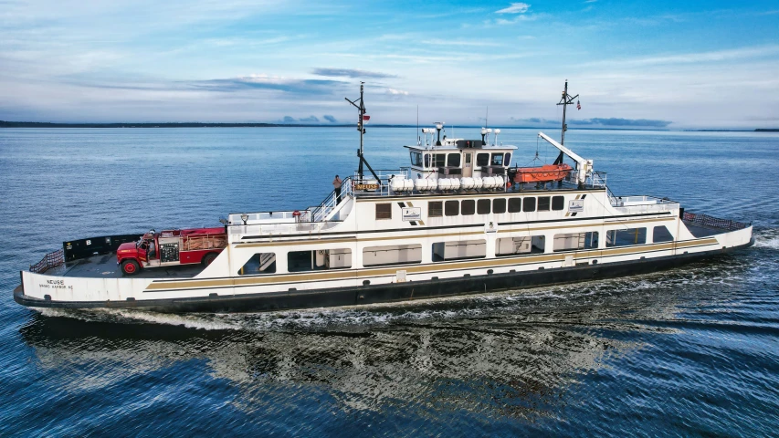 a boat riding in the ocean with people on board