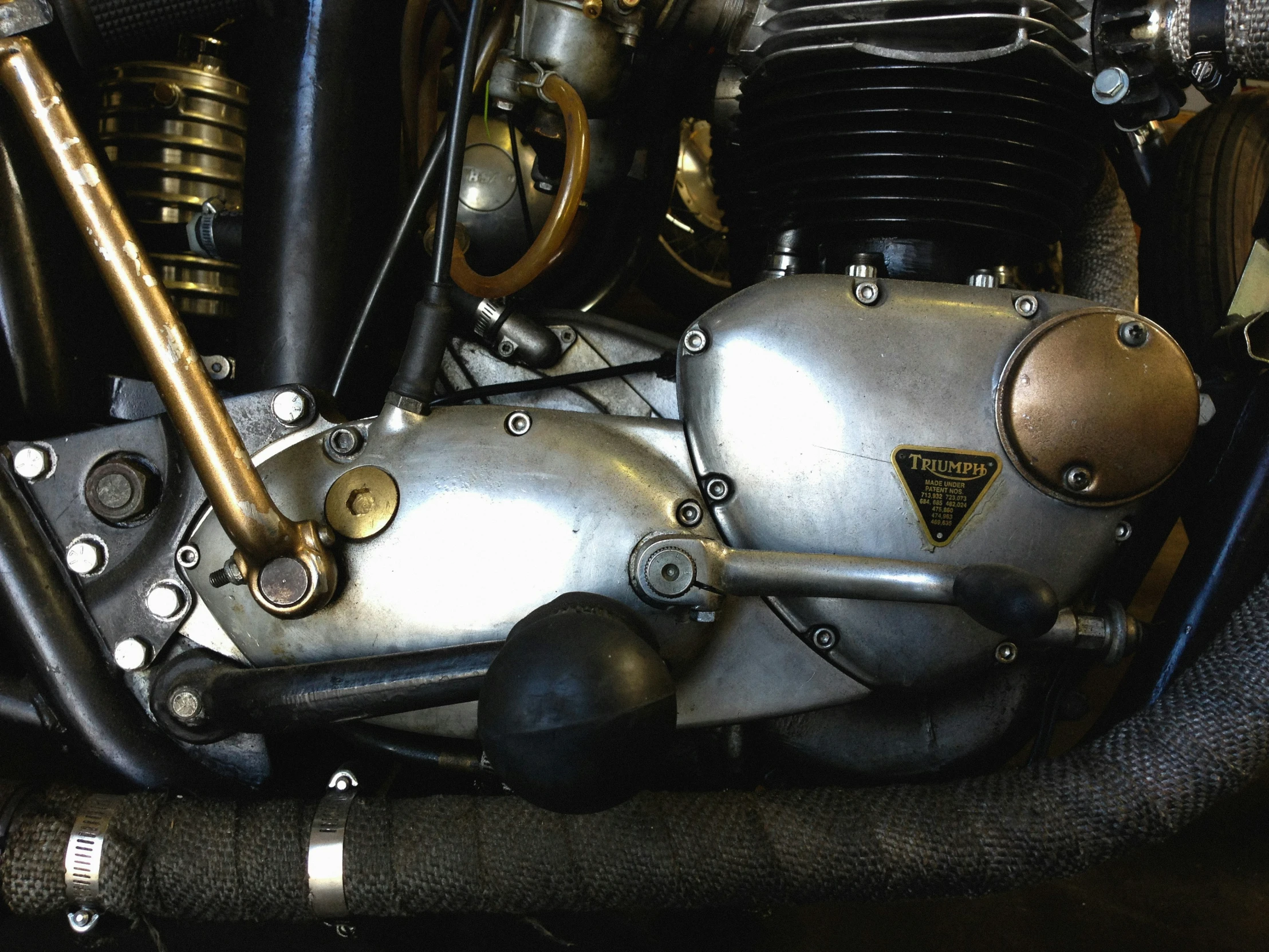 a metal motorbike with gold detailing is displayed