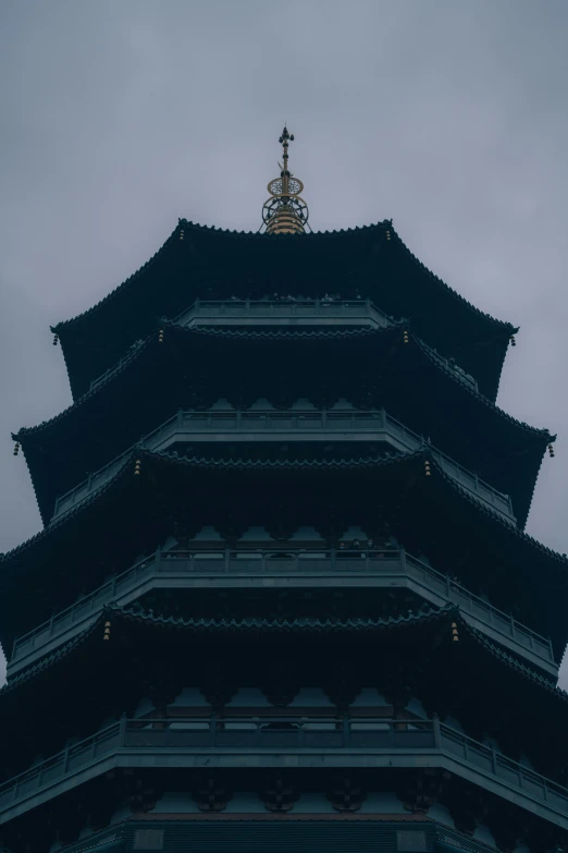 a tall tower structure with a clock on the top