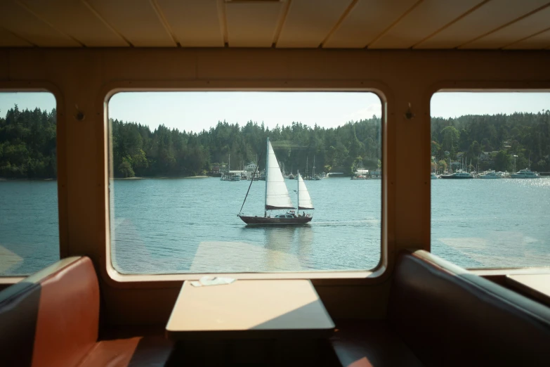 a small boat is sailing on the lake