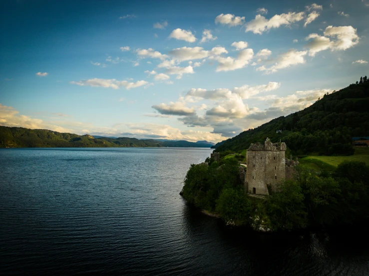 the castle sits on top of the island in front of the lake