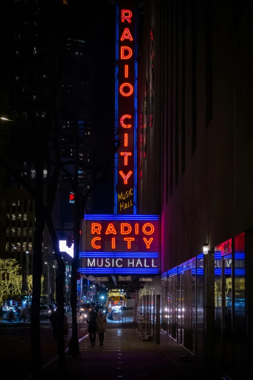 a very tall building with lights on it's side