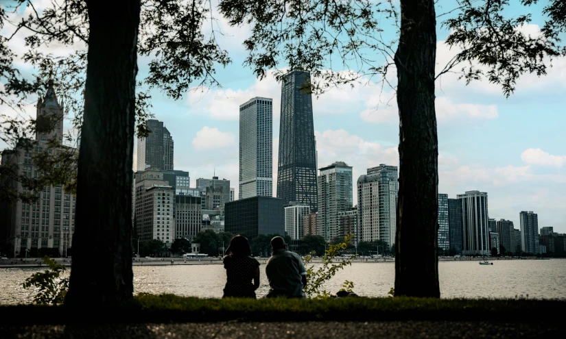 two people standing in front of the city skyline