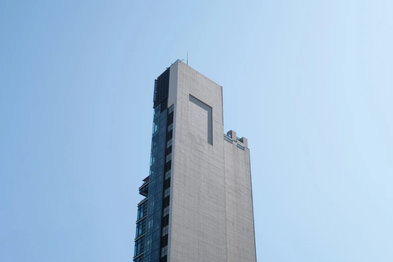 a tall building with several people standing on top