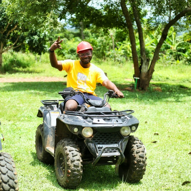 a man is riding a four - wheeler at the park