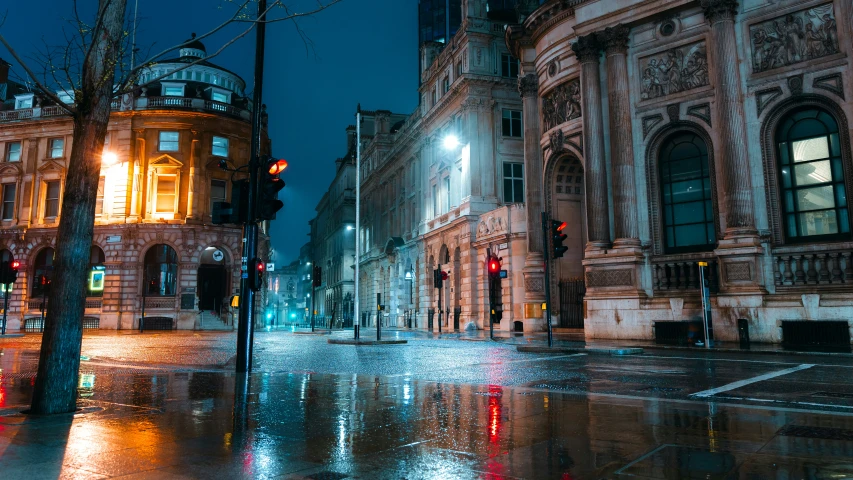 an empty street in a european city is shown at night