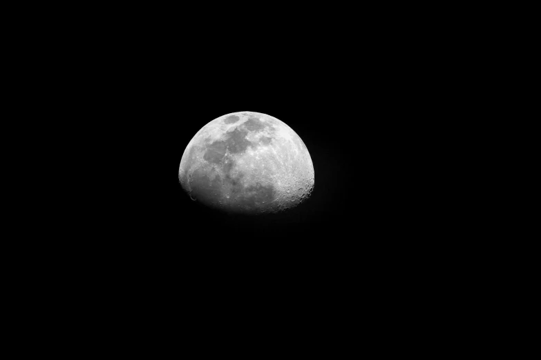 a white ball in the sky against black background