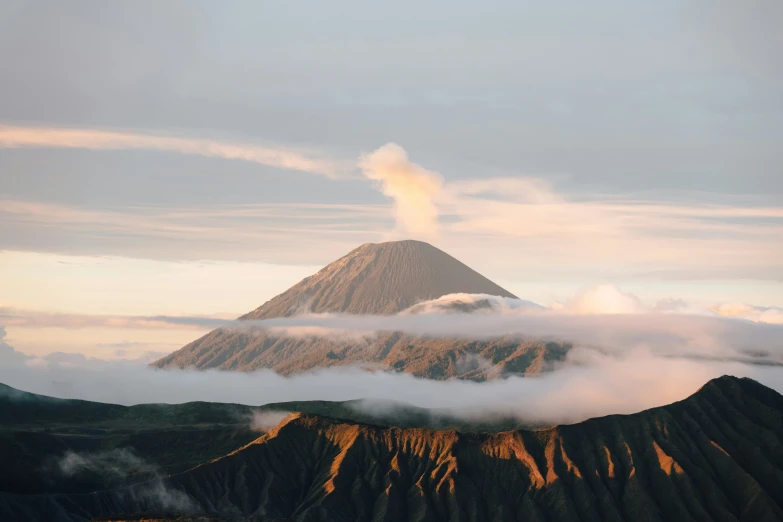 a mountain with steam rising up from the top