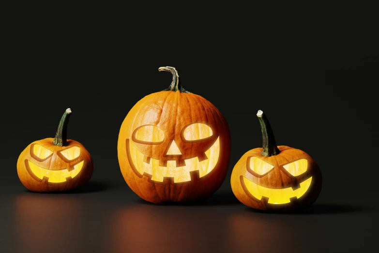 three pumpkins that are on a table