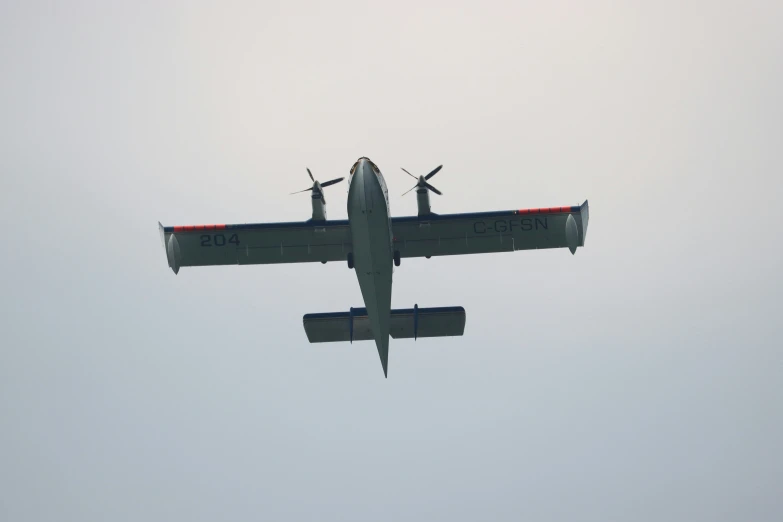 an airplane is flying sideways in the sky