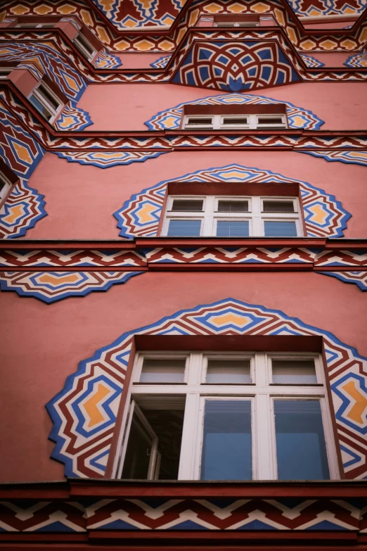 the windows are decorated with tiles and paint