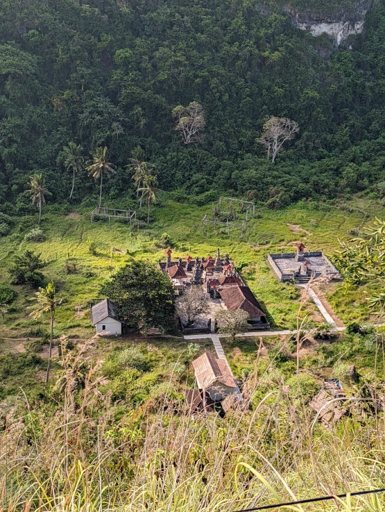 there is an old house in the middle of some grassy land